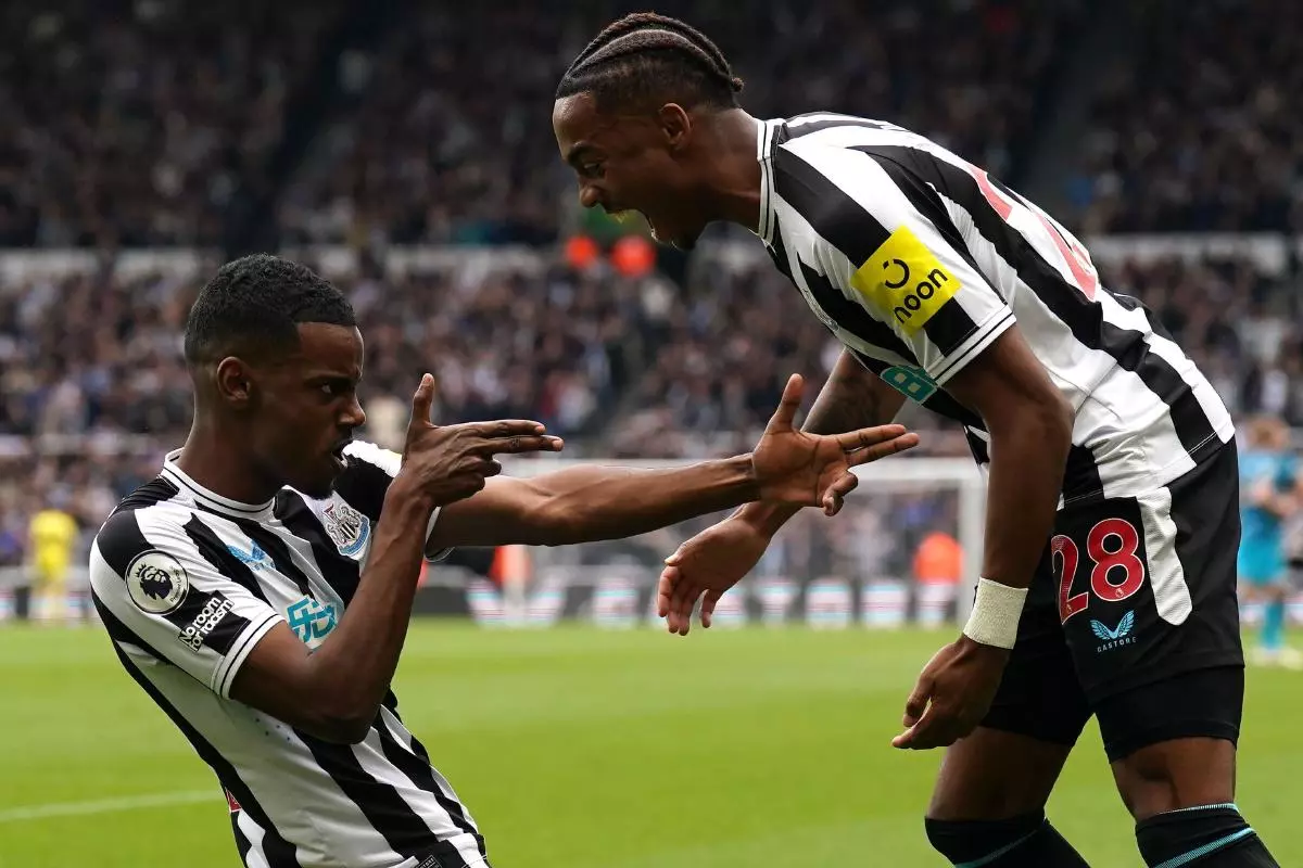 Newcastle United's Alexander Isak celebrates scoring their side's fourth goal of the game with team-mate Joe Willock