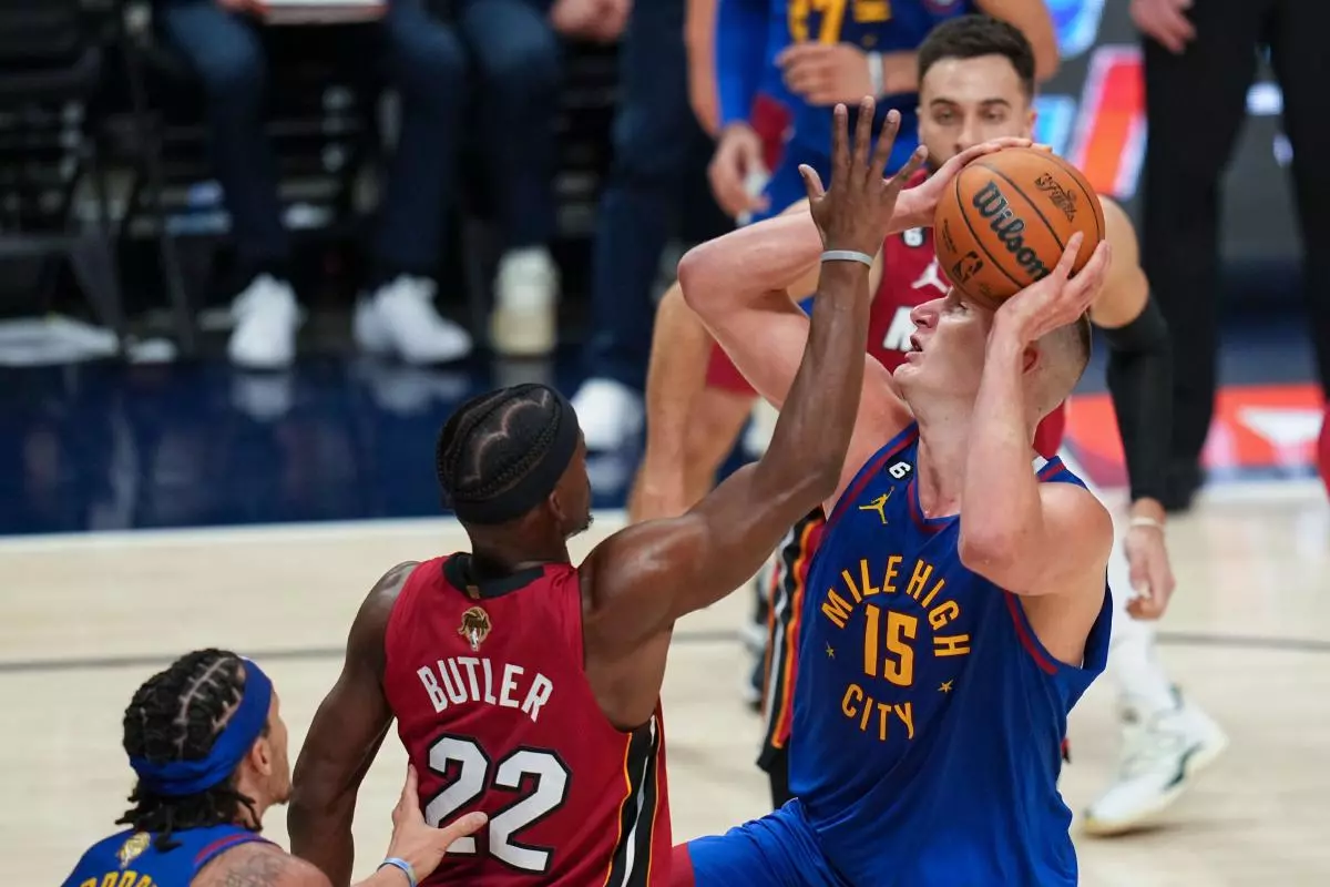 Denver Nuggets center Nikola Jokic defended by Jimmy Butler June 1, 2023