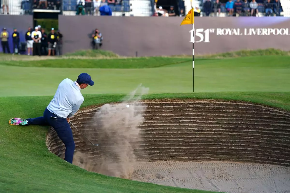Northern Ireland's Rory McIlroy chips out of a bunker on the 18th during day one of The Open at Royal Liverpool - July 2023
