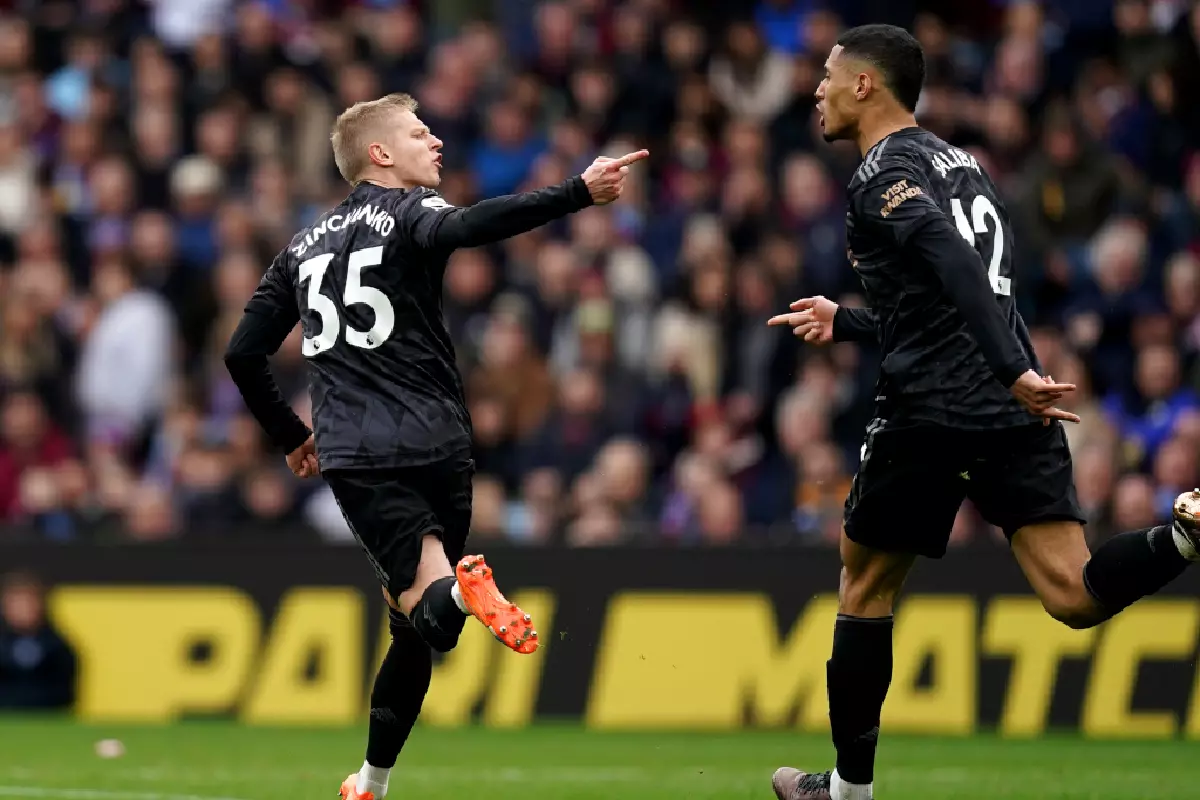 Oleksandr Zinchenko wheels away against Villa Feb 2023