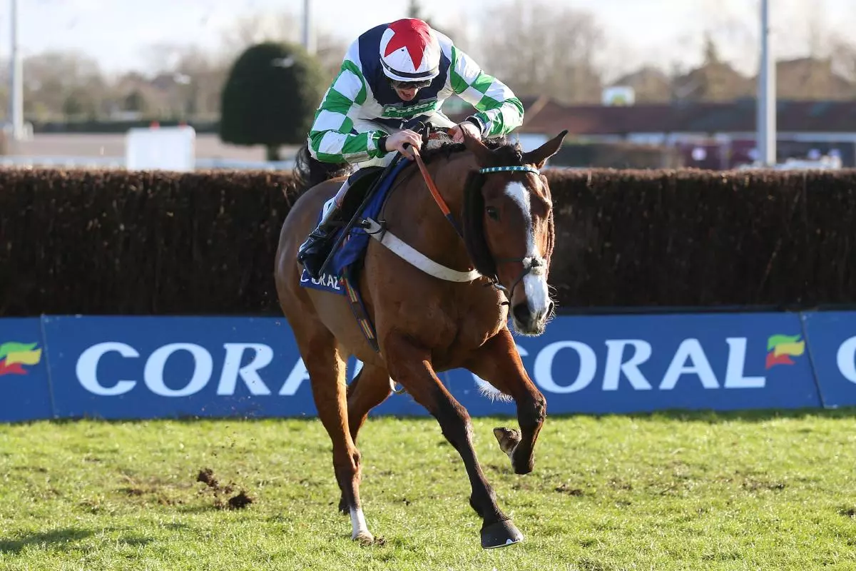 Our Power ridden by Sam Twiston-Davies clears a fence before winning the Coral Trophy Handicap Chase at Kempton Park