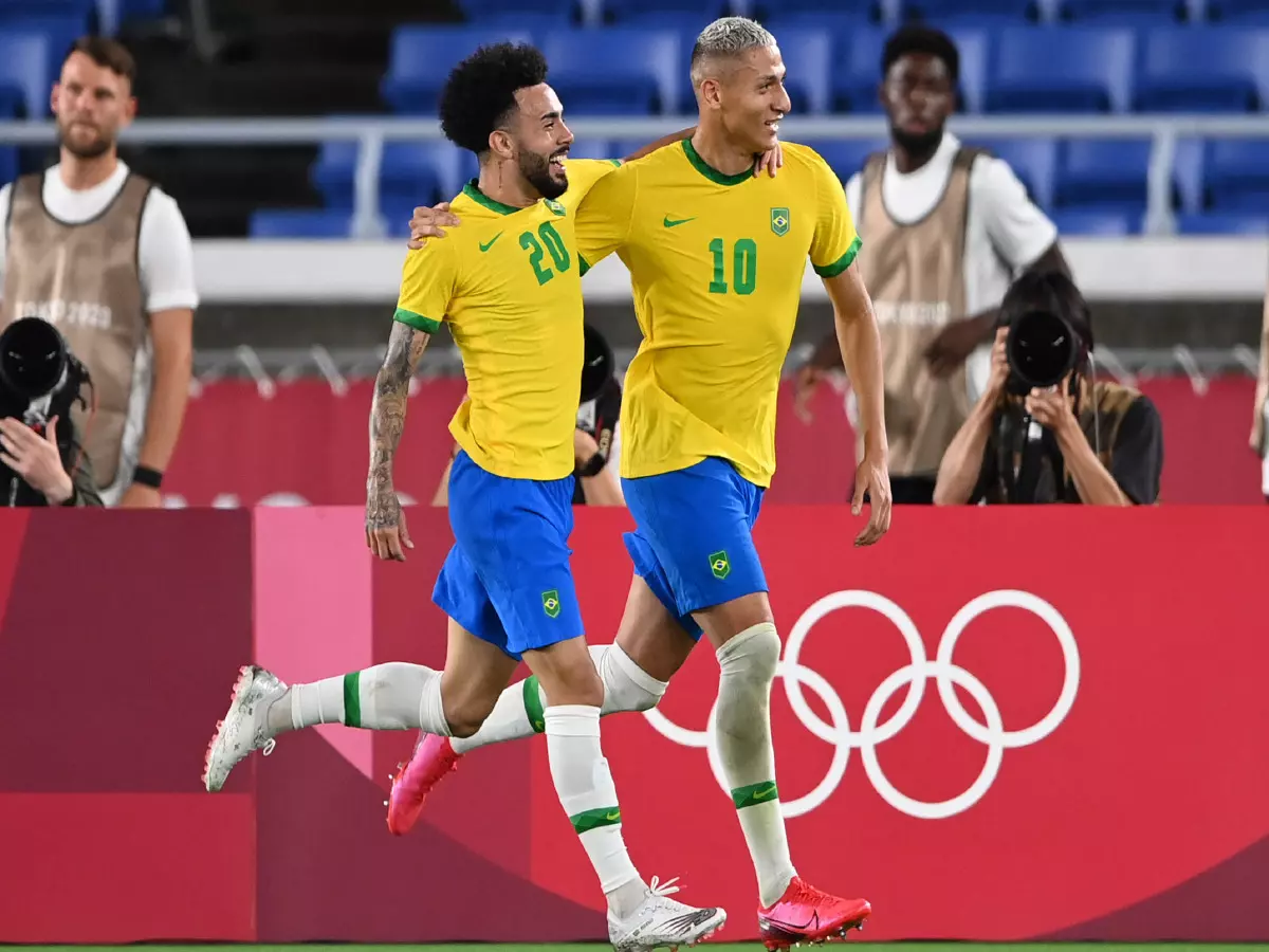 Richarlison celebrates with Claudinho