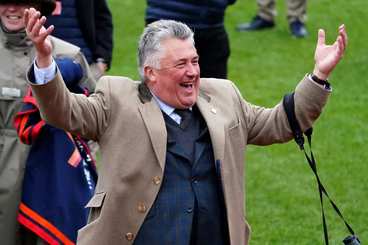 Paul Nicholls celebrates after Stage Star wins the Turners' Novices' at Cheltenham