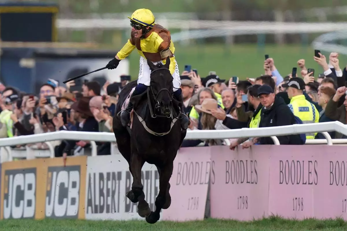 Paul Townend celebrates winning the Boodles Cheltenham Gold Cup Chase aboard Galopin Des Champs