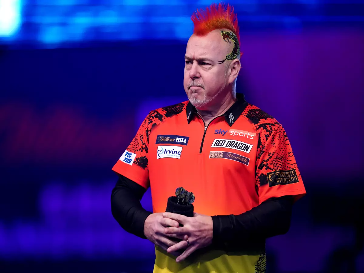Peter Wright during his walk on before his match against Gabriel Clemens during day ten of the William Hill World Darts Championship at Alexandra Palace, London.