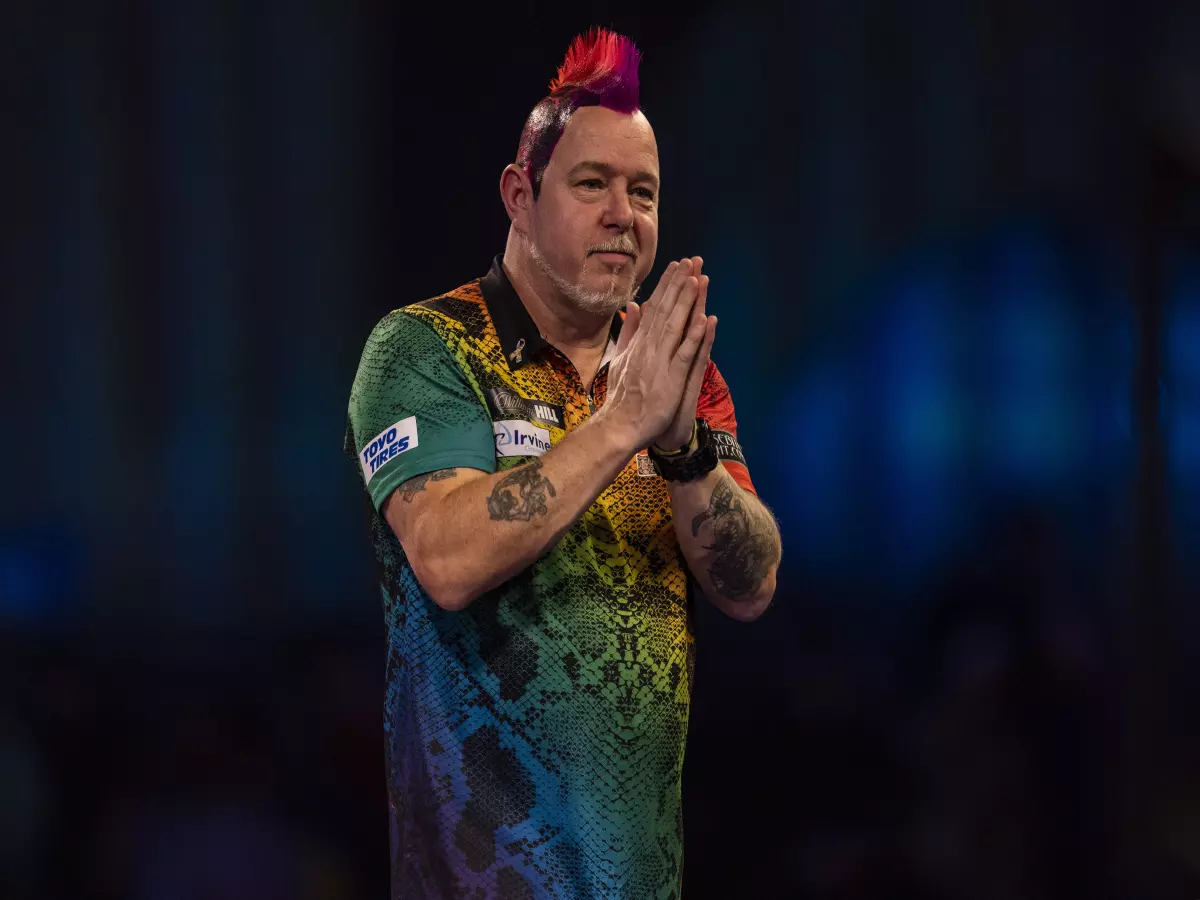 Peter Wright celebrates beating Ryan Searle (not in picture) during day thirteen of the William Hill World Darts Championship at Alexandra Palace, London. Picture date: Thursday December 30,