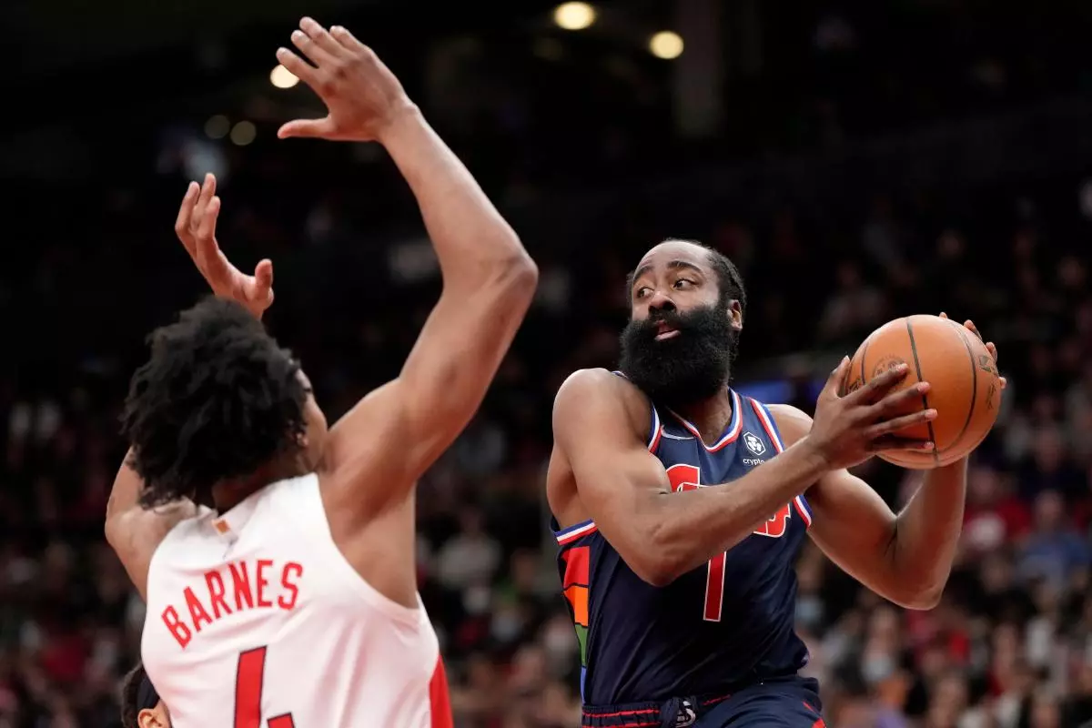 Philadelphia 76ers guard James Harden (1) drives to the net