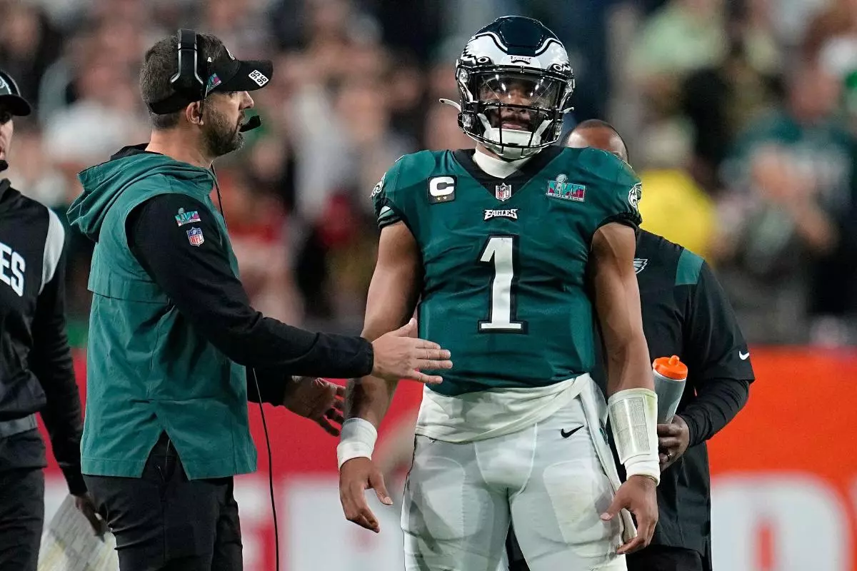 Philadelphia Eagles head coach Nick Sirianni, left, talks with quarterback Jalen Hurts