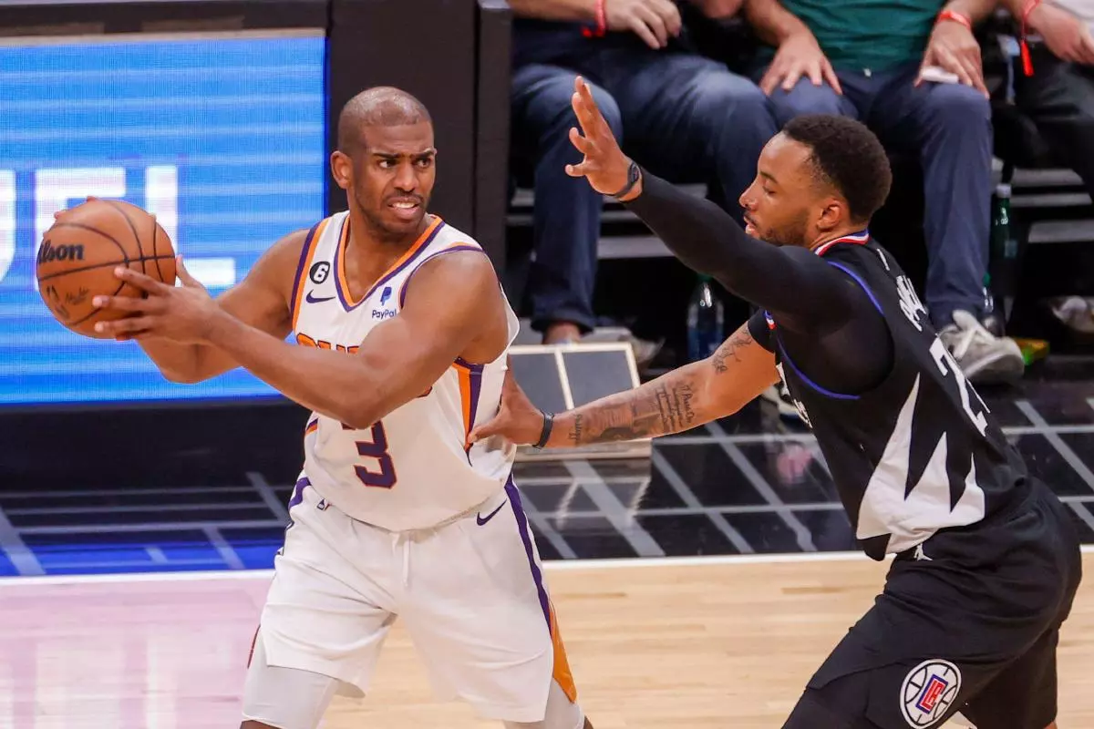 Phoenix Suns guard Chris Paul (3) is defended by Los Angeles Clippers guard Norman Powell - April 2023