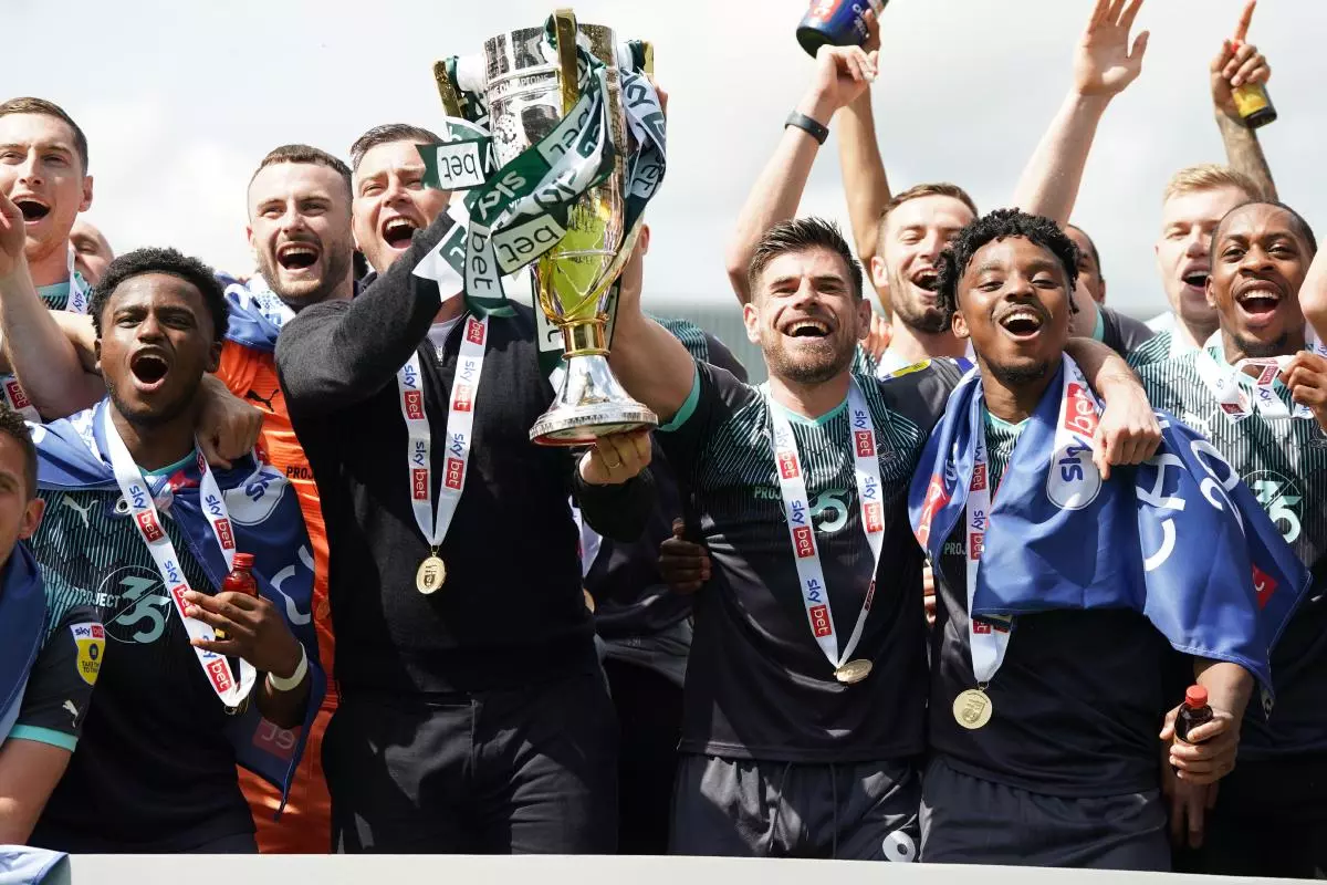 Plymouth Argyle manager Steven Schumacher and team with League One title