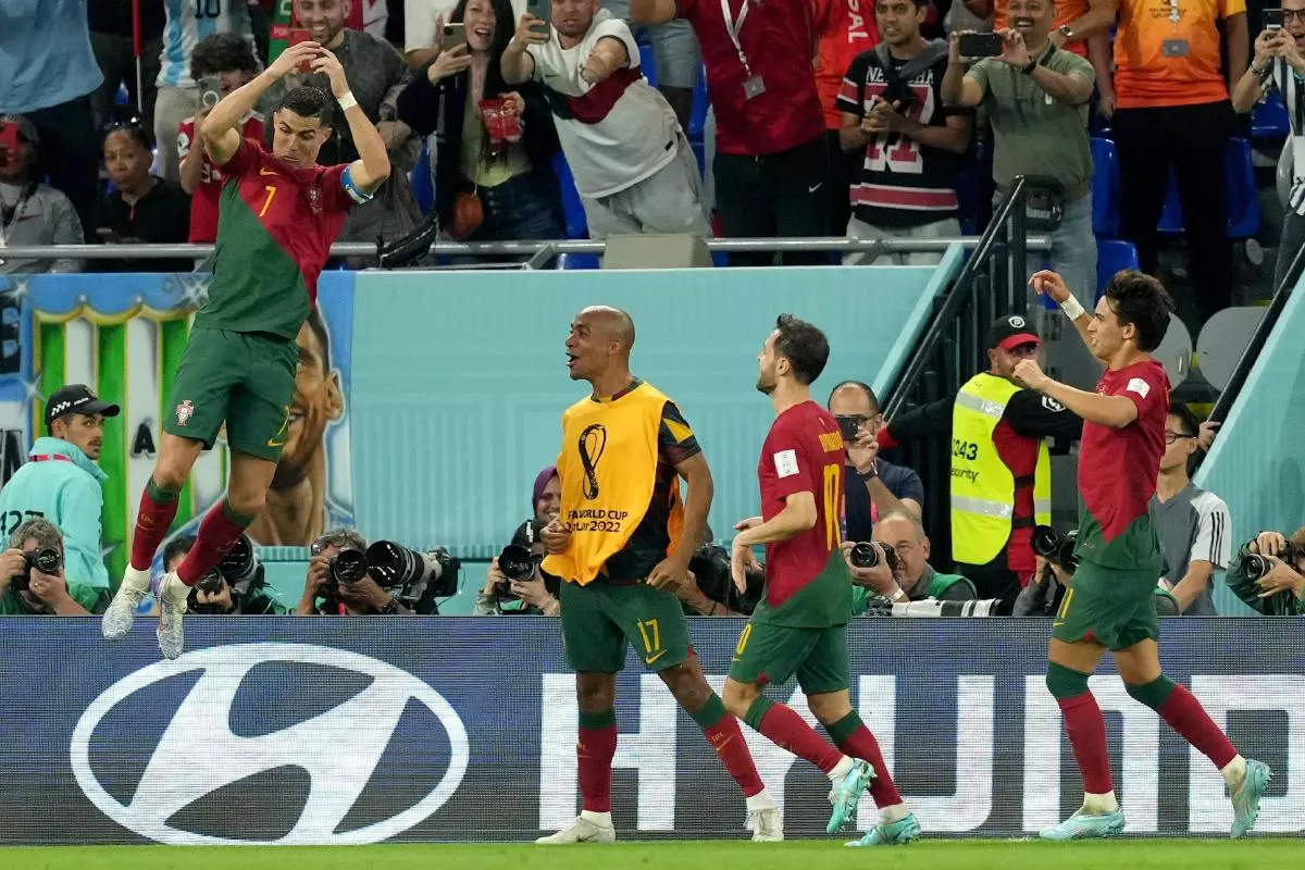 Portugal's Cristiano Ronaldo celebrates scoring the opening goal against Ghana at the 2022 World Cup
