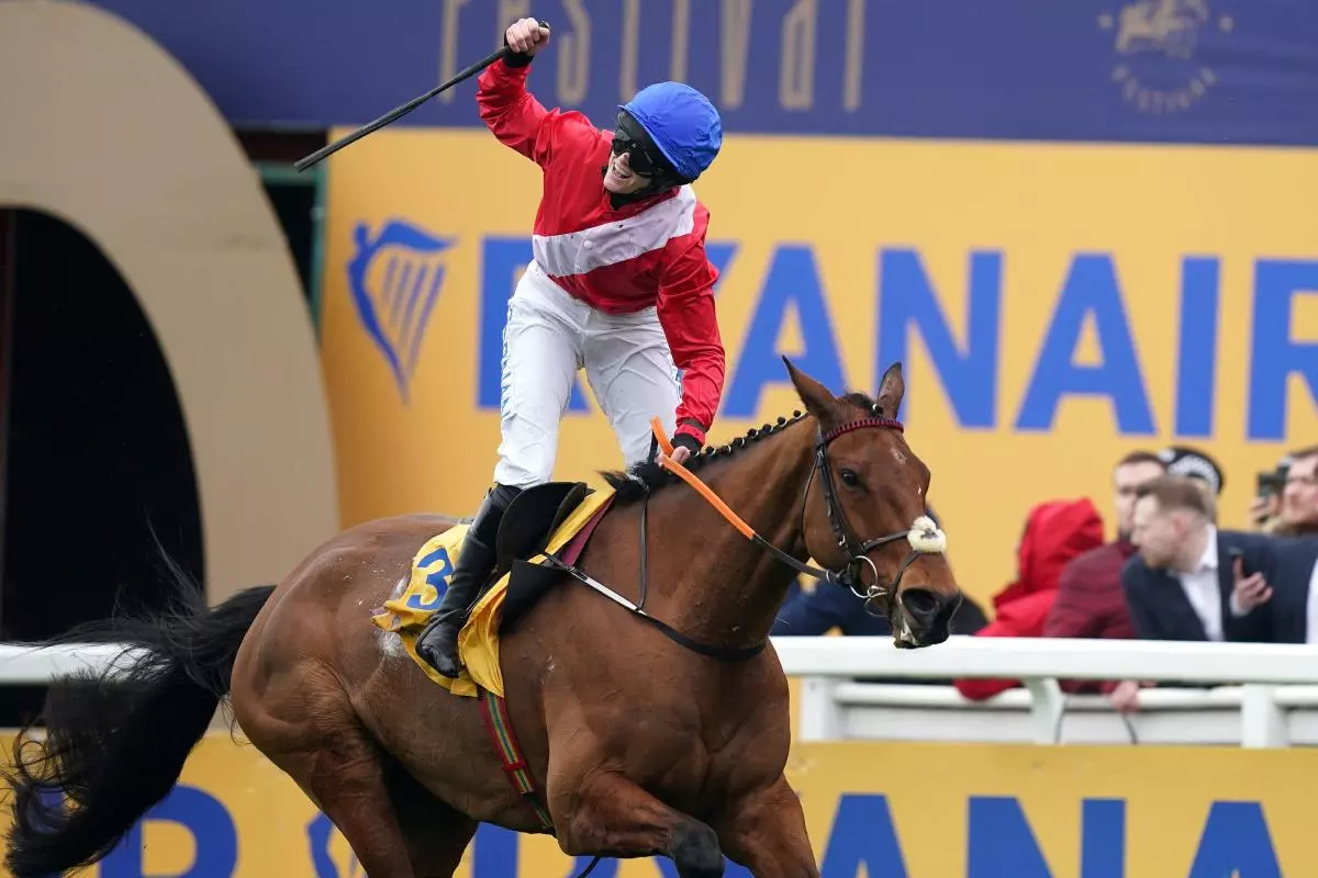 Rachael Blackmore celebrates after winning the Ryanair Chase aboard Envoi Allen