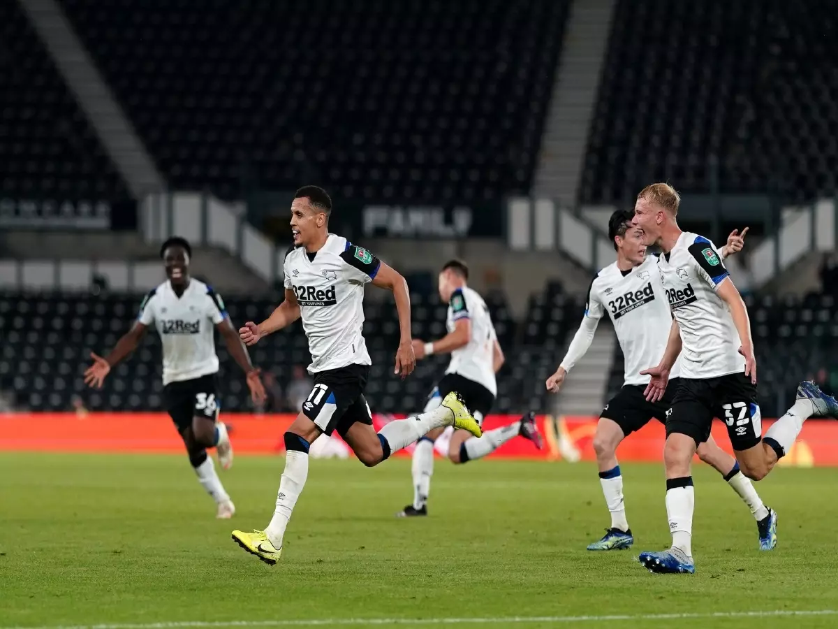 Ravel Morrison wheels off in celebration after scoring for Derby County against Salford in the first round of the Carabao Cup.