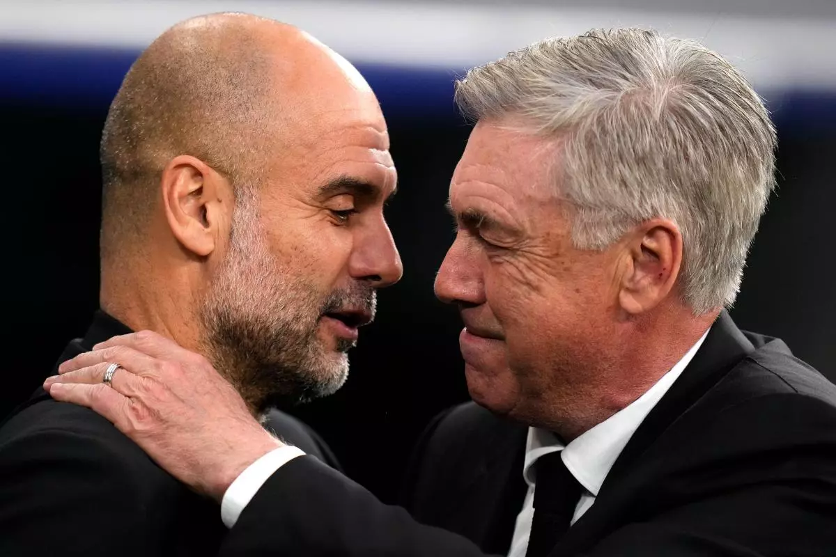 Real Madrid's head coach Carlo Ancelotti, right, greets Manchester City's head coach Pep Guardiola