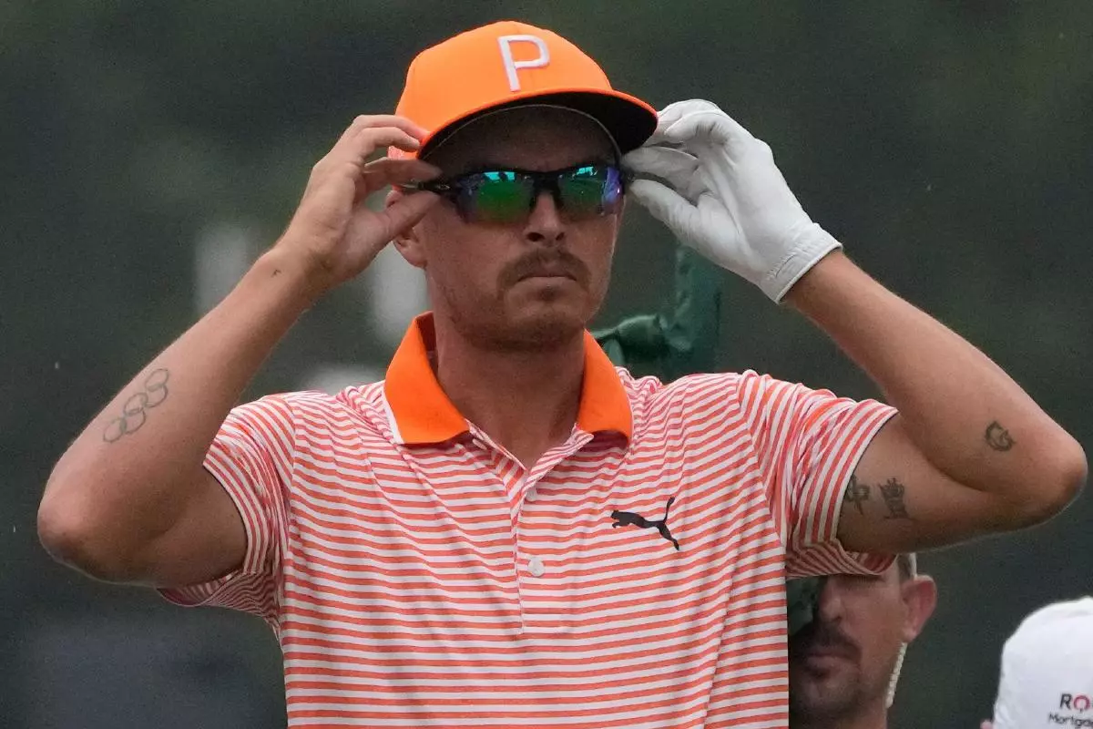 Rickie Fowler prepares to drive off