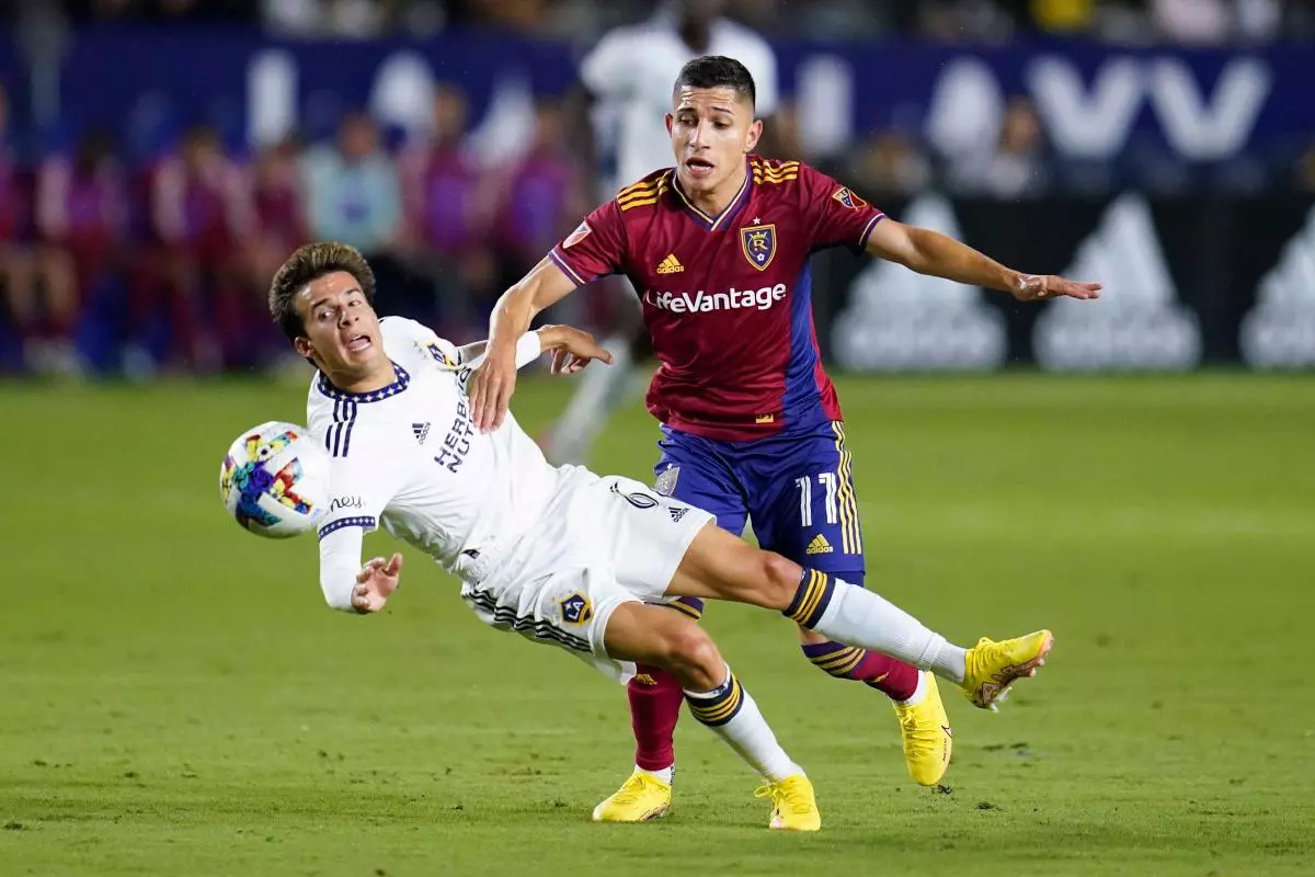 LA Galaxy midfielder Riqui Puig is challenge by Jefferson Savarino of Real Salt Lake Oct. 1, 2022