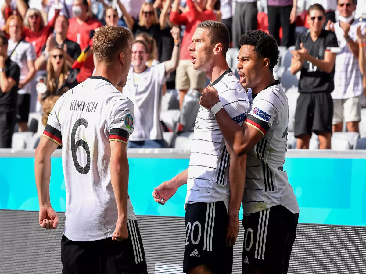 Euro 2021 GROUP C Match 24 in Munich Portugal Germany 19 06 2021 Joshua Kimmich, Robin Gosens and Serge Gnabry v l , all Germany cheer after the would-be goal to 1 0.