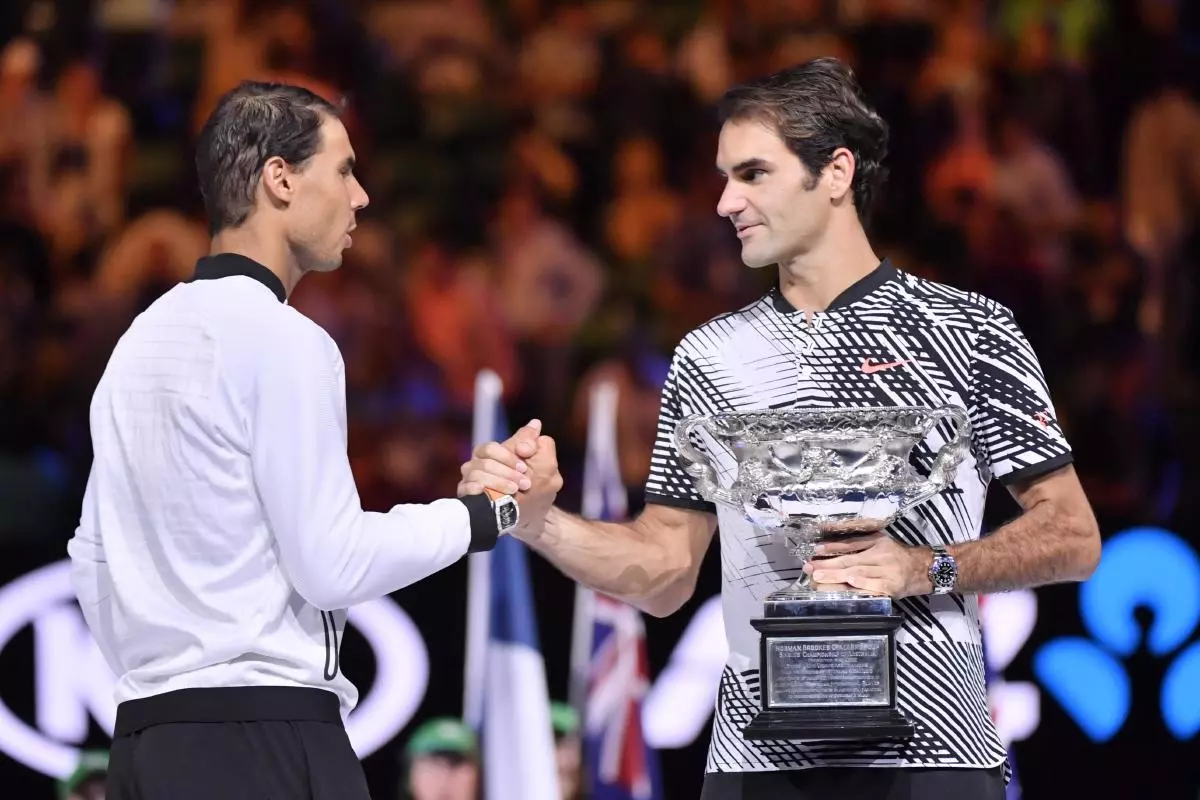Roger Federer (R) shaking hands with Spain's Rafael Nadal