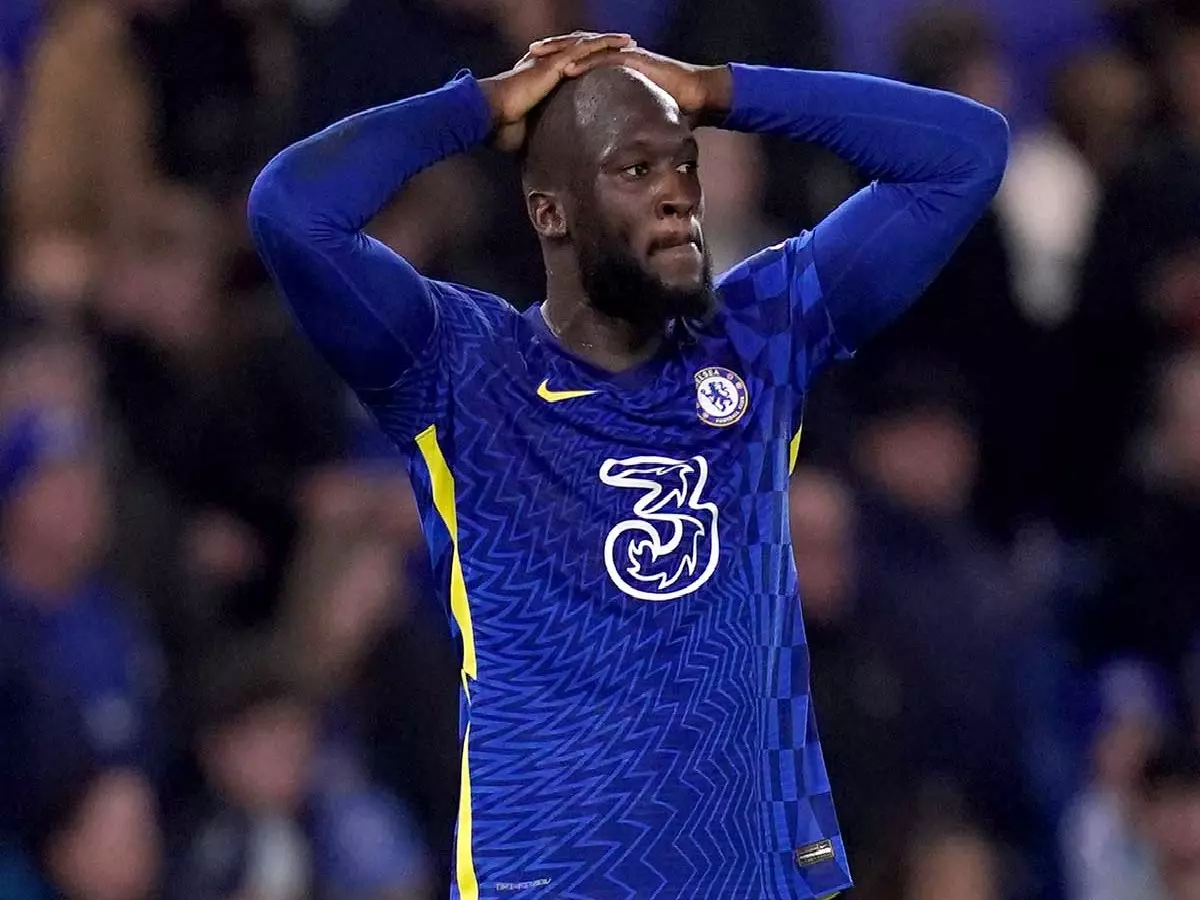 Romelu Lukaku with head in hands