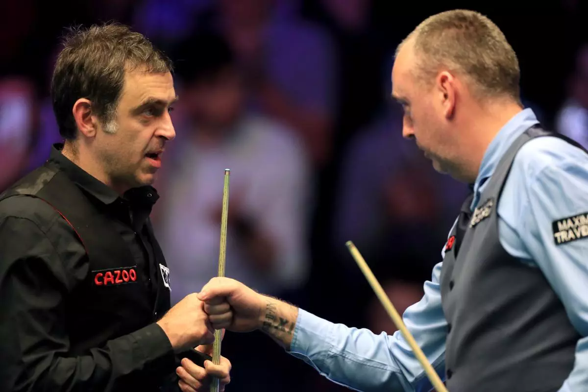 Ronnie O'Sullivan congratulates Mark Williams after his win at the Masters