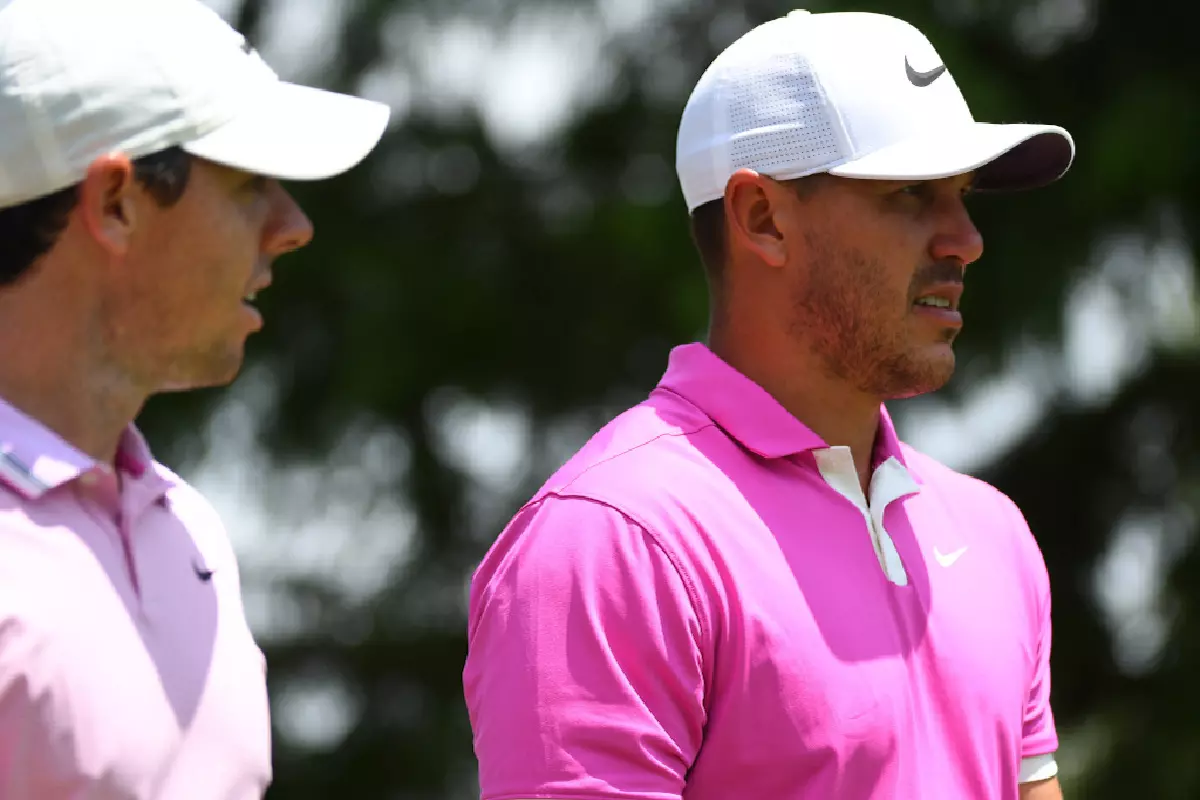 Rory McIlroy (L) and Brooks Koepka together