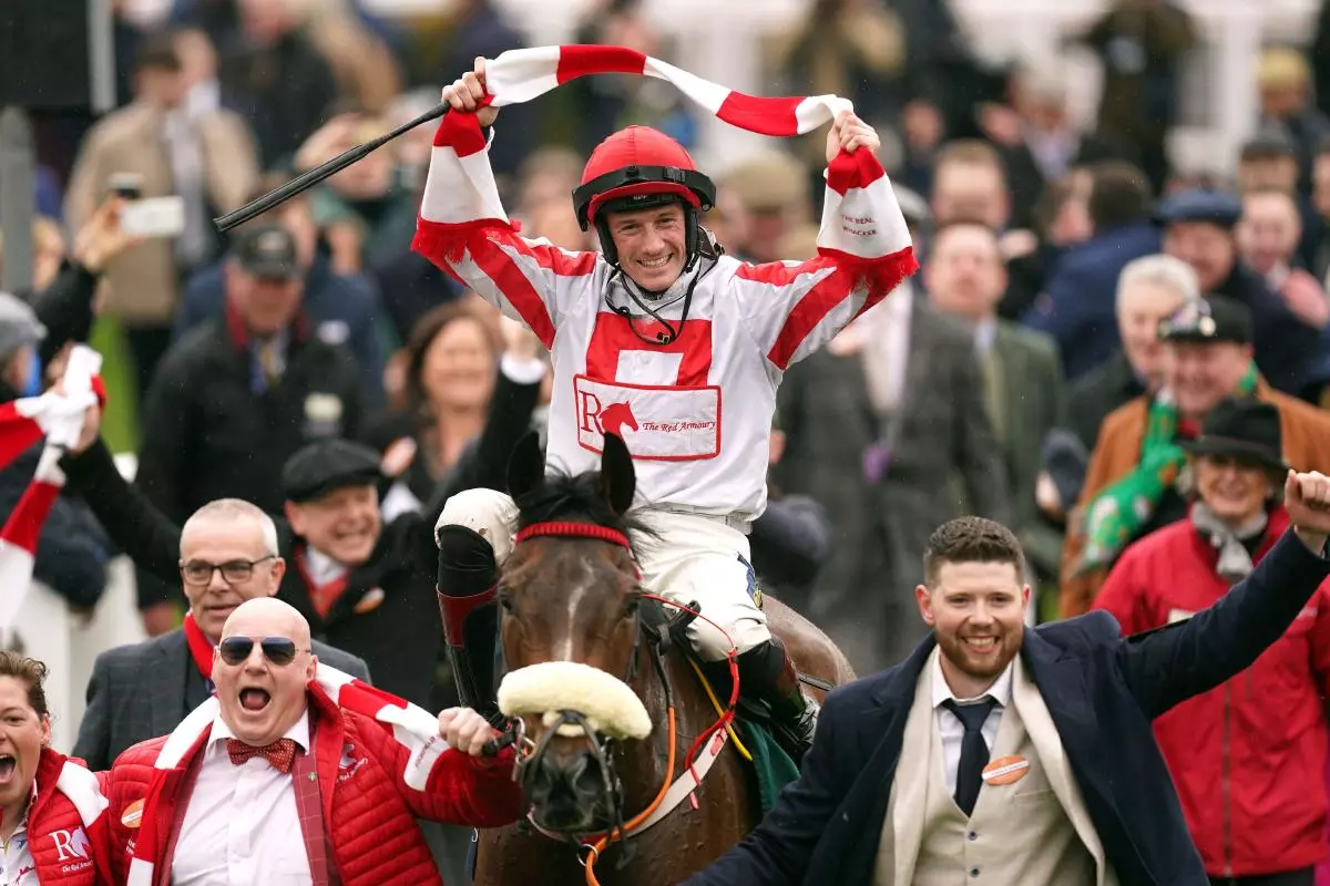 Sam Twiston-Davies celebrates winning the Brown Advisory Novices' Chase aboard The Real Whacker
