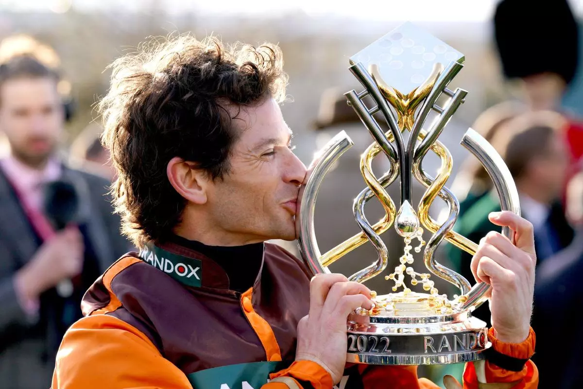 Sam Waley-Cohen kisses Grand National trophy after winning on Noble Yeats