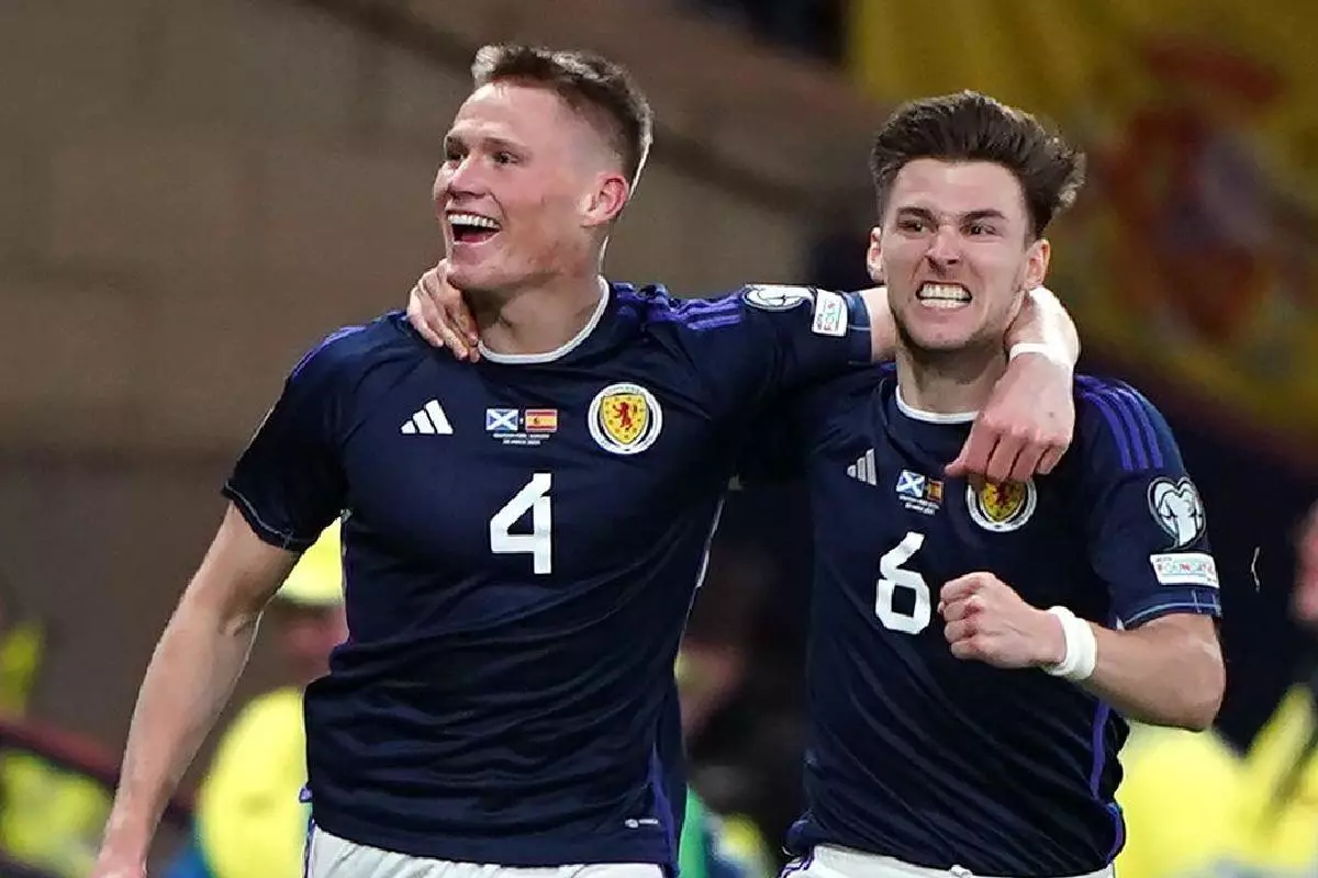 Scotland's Scott McTominay (left) celebrates scoring their side's second goal of the game with team-mate Kieran Tierney