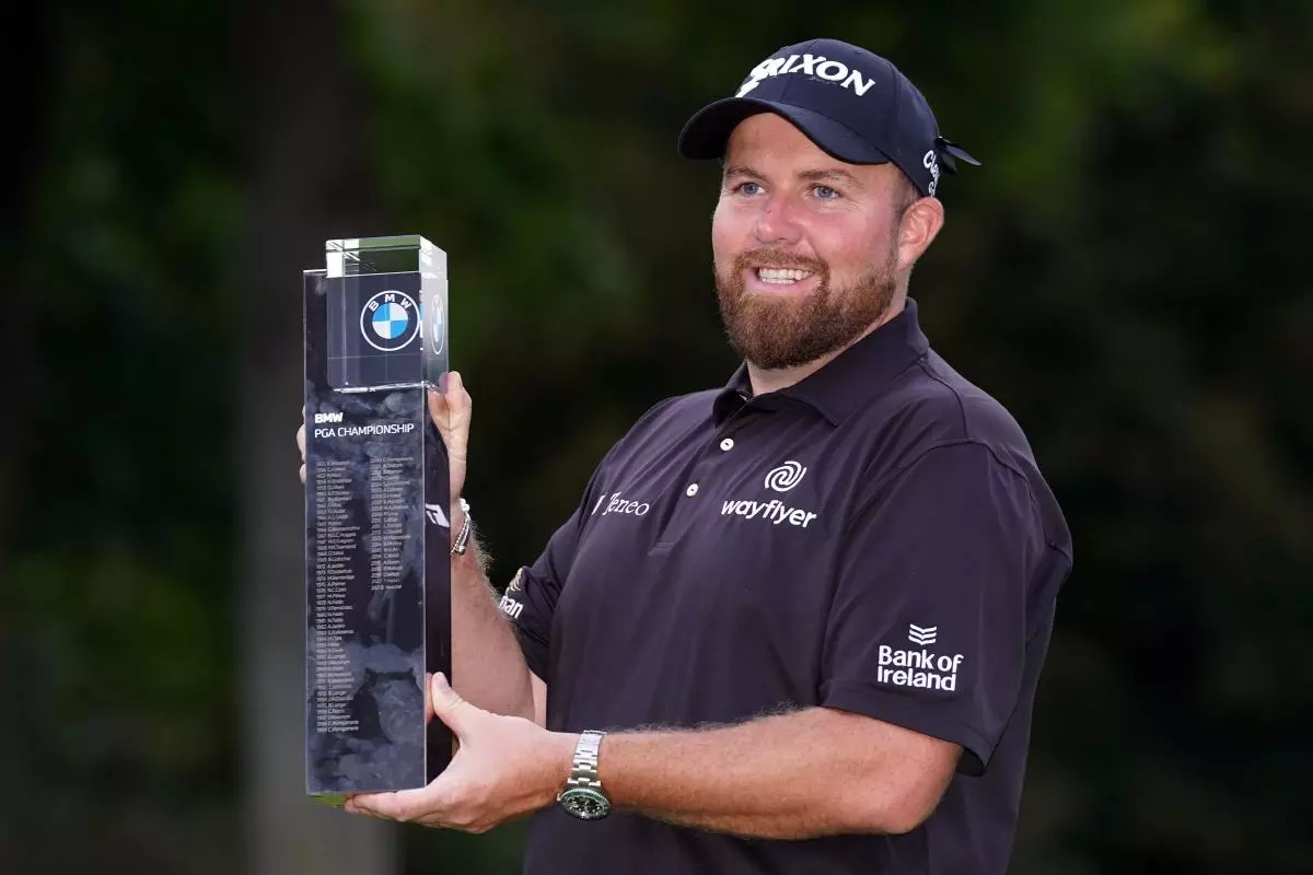Shane Lowry lifts the trophy following day four of the BMW PGA Championship