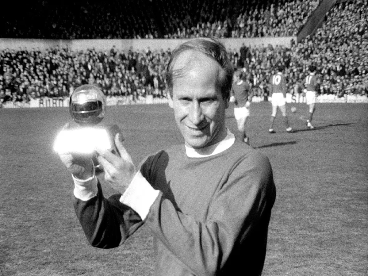 Sir Bobby Charlton holds the 1966 European player of the year award