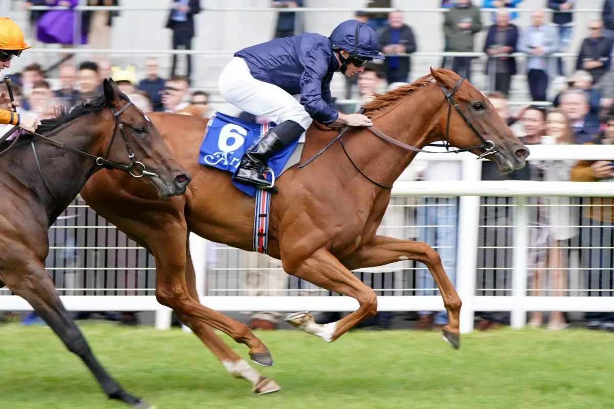 Statuette ridden by jockey Ryan Moore wins the Airlie Stud Stakes during day three of the Derby Festival at Curragh
