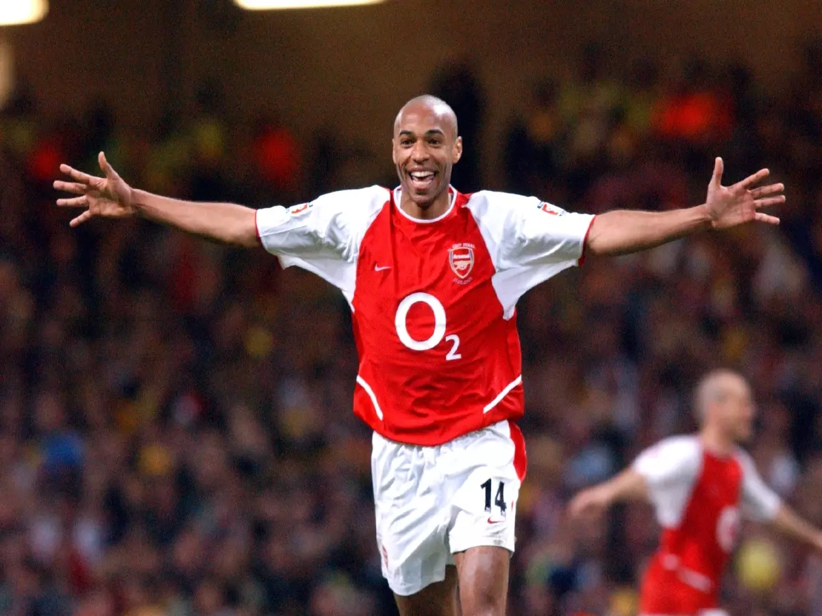 Thierry Henry celebrates scoring for Arsenal in the Premier League, 2003