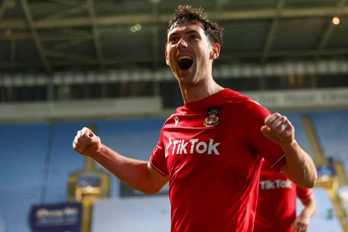Tom O’Connor of Wrexham celebrates scoring against