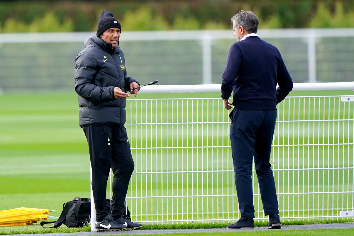 Tottenham Hotspur manager Antonio Conte speaks to managing director Fabio Paratici