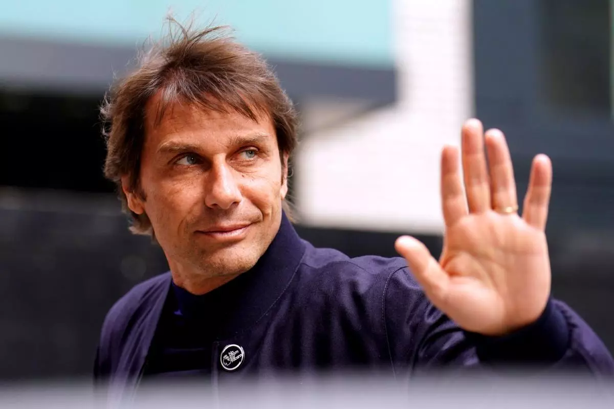 Tottenham Hotspur manager Antonio Conte waves to fans