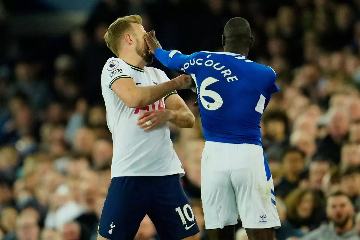 Tottenham's Harry Kane is pushed by Everton's Abdoulaye Doucoure