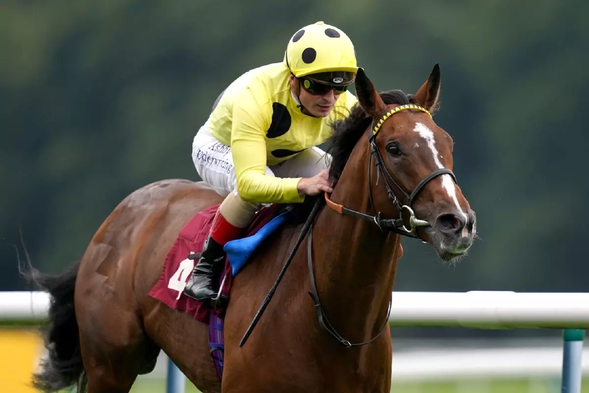 Triple Time ridden by Andrea Atzeni (right) wins The Betfair Exchange Ascendant Stakes at Haydock Park racecourse Sep21