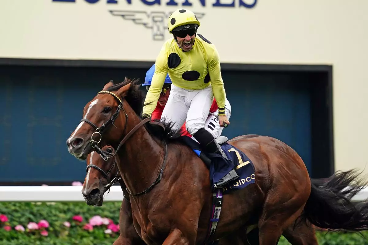 Triple Time ridden by jockey Neil Callan wins the Queen Anne Stakes