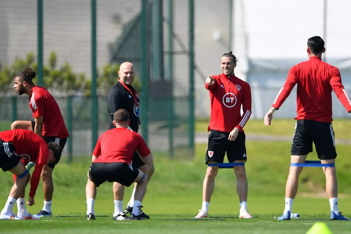 Wales' Gareth Bale (second right) and coach Robert Page (back, centre) during the training session at the Vale Resort