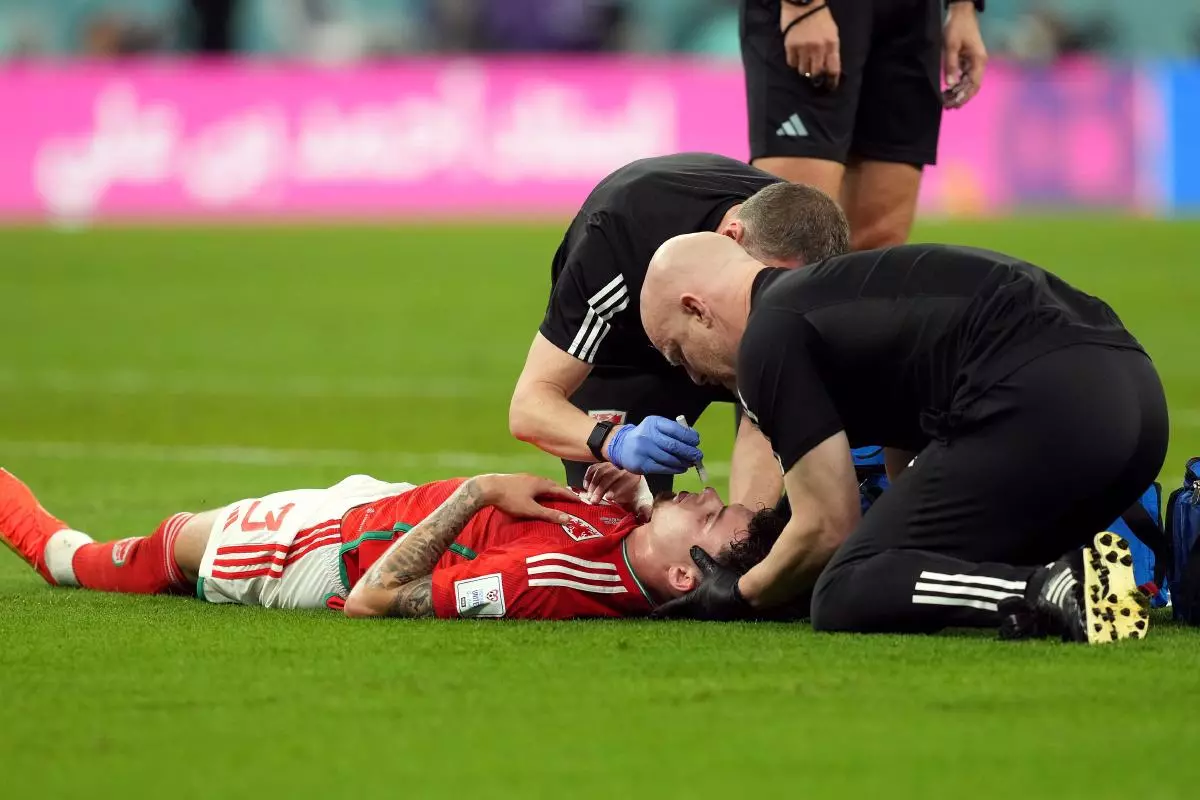 Wales’ Neco Williams receives treatment