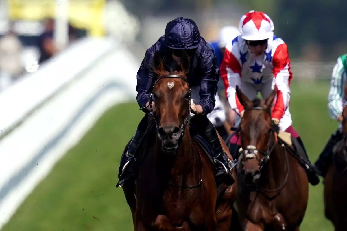 Warm Heart ridden by Ryan Moore on their way to winning the Ribblesdale Stakes
