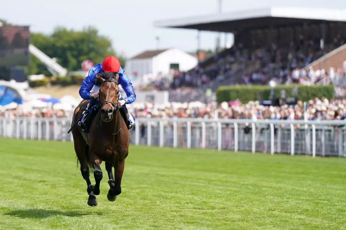 Warren Point ridden by William Buick (right) wins the Coral Kincsem Handicap on day three of the Qatar Goodwood Festival 2022 at Goodwood Racecourse