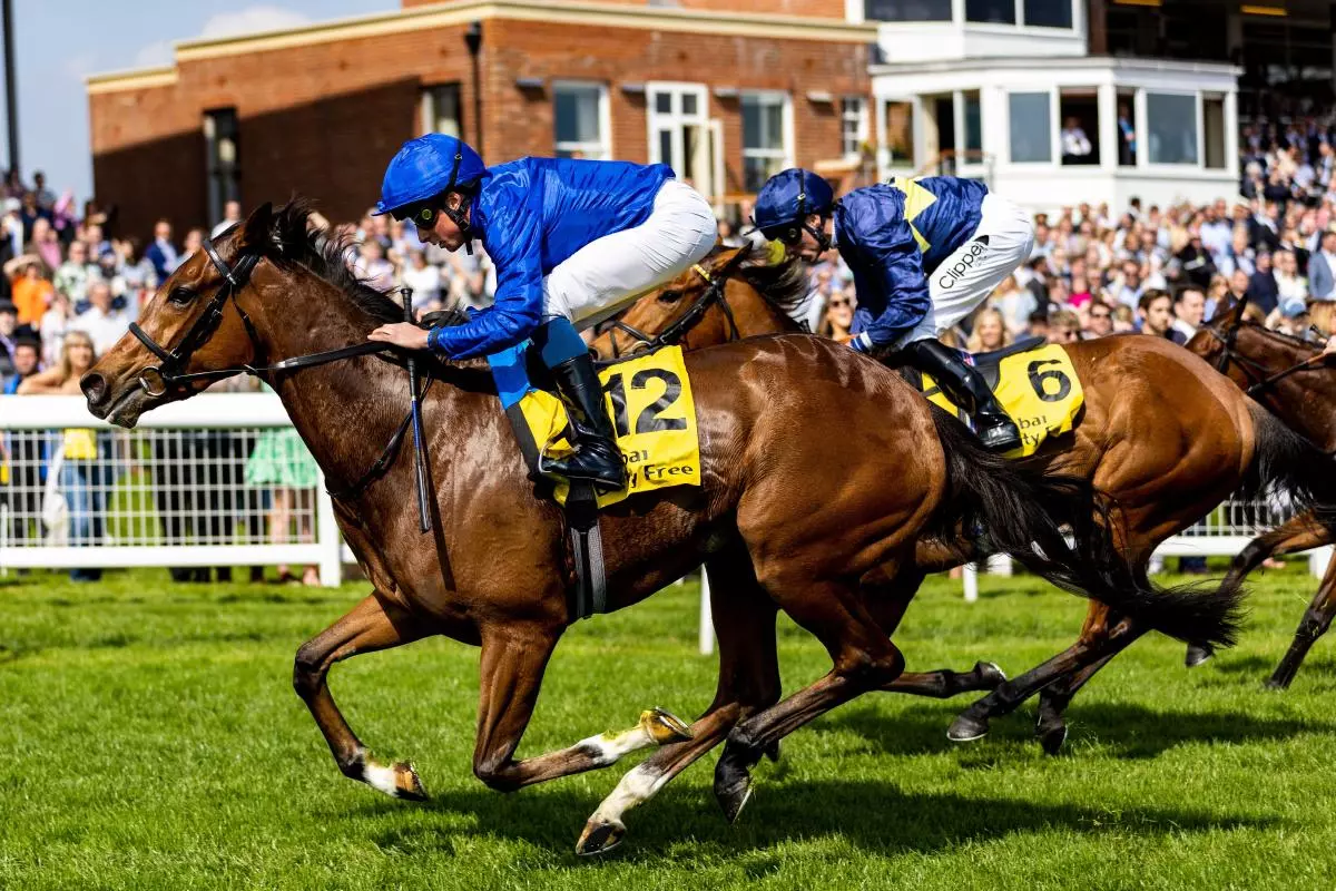Wild Beauty ridden by jockey William Buick winning the Dubai Duty Free Stakes at Newbury