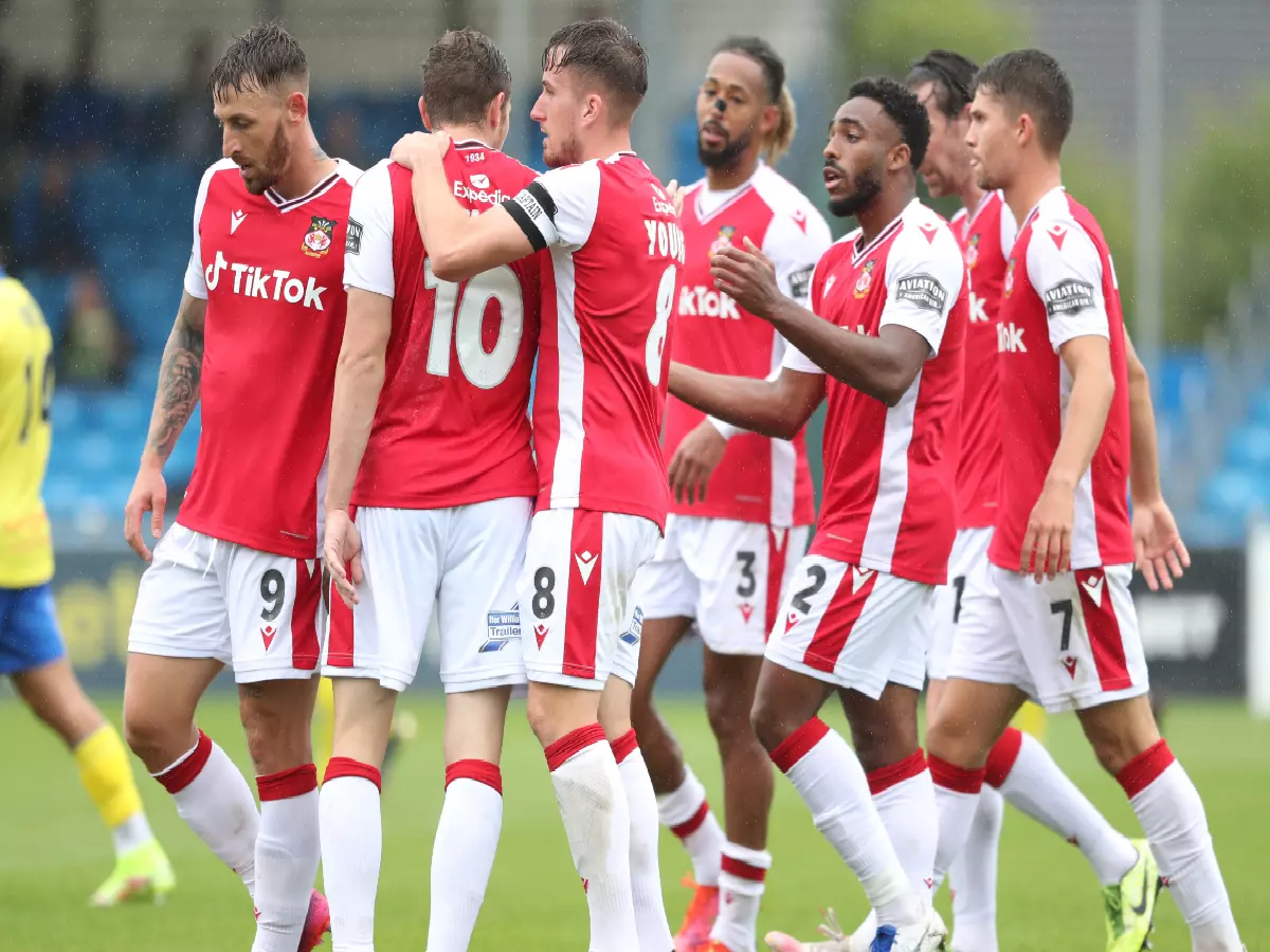 Wrexham celebrates as a team after Paul Mullin scores the sides first goal, August 21, 2021