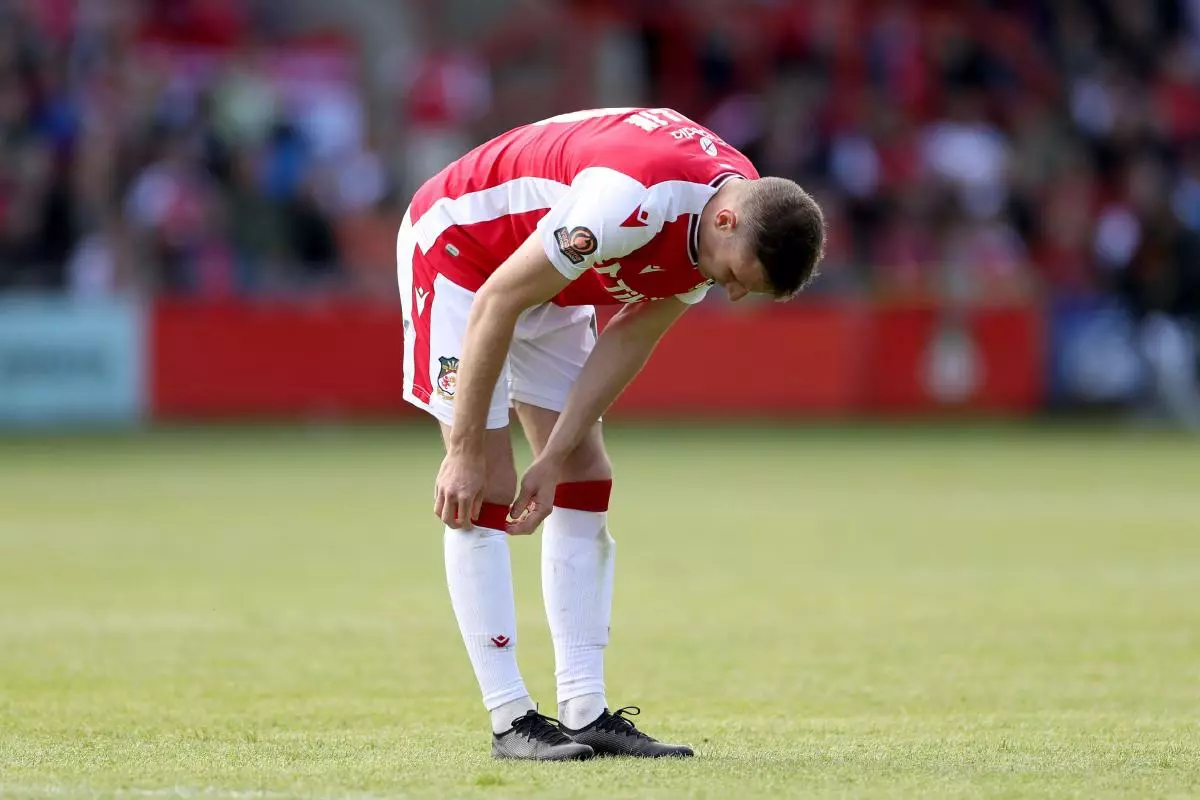 Wrexham's Paul Mullin shows his dejection during the Vanarama National League semi-final match at The Racecourse Ground