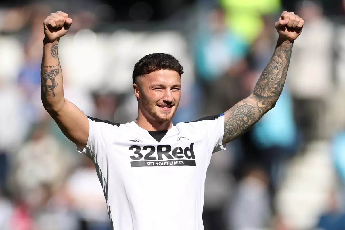 Boxer Zach Parker on the pitch at half time promoting his upcoming fight during the Sky Bet Championship match at Pride Park Stadium, Derby.
