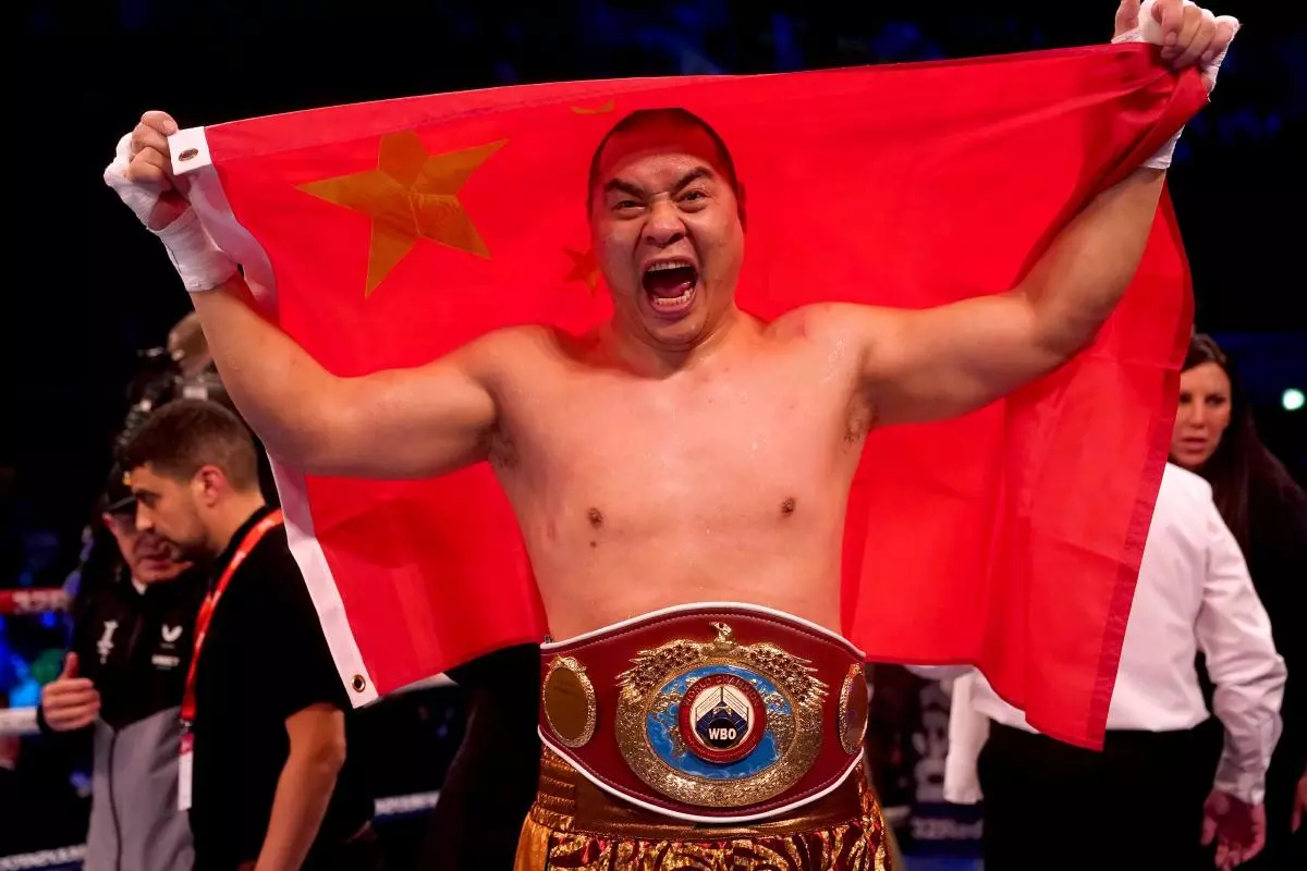 Zhilei Zhang celebrates after beating Joe Joyce to win their WBO Interim World Heavyweight