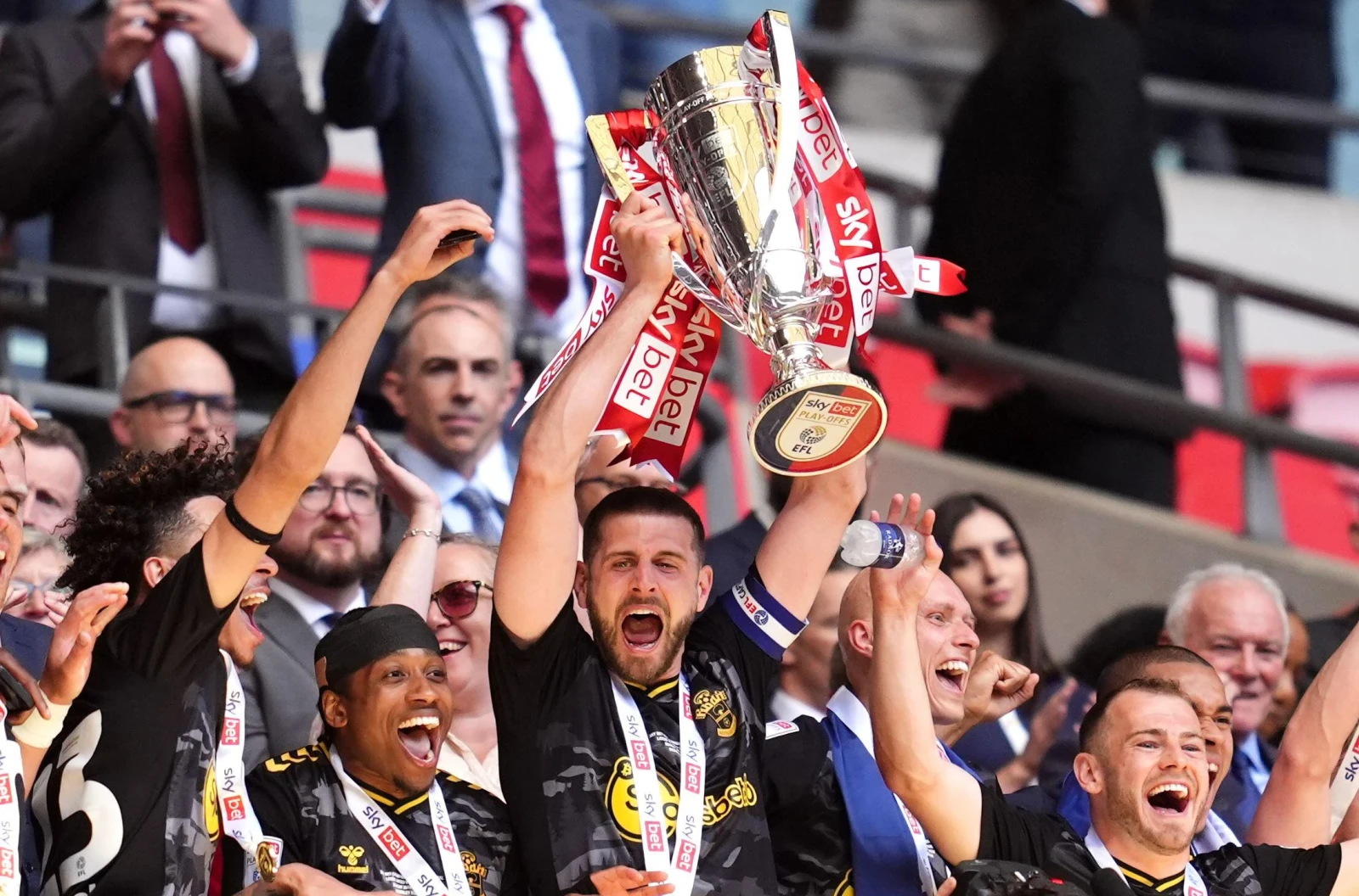 Southampton's Jack Stephens lifts the trophy