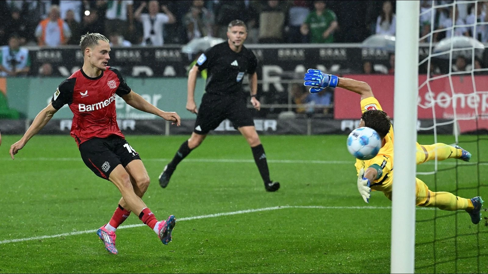 Florian Wirtz of Bayer Leverkusen scores the winning goal