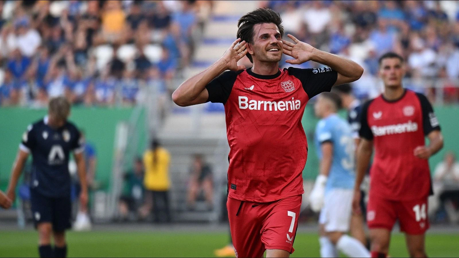 Jonas Hofmann celebrates scoring for Bayer Leverkusen